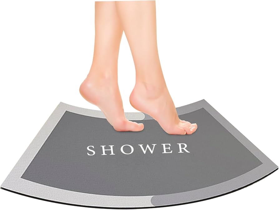 Problems Solved curved shower mat with absorbent, non-slip surface and quadrant design for safe, comfortable bath use.