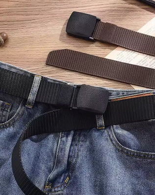 Men's casual canvas belt from Problems Solved featuring a metal-free design, shown in a close-up of the belt's textured fabric.