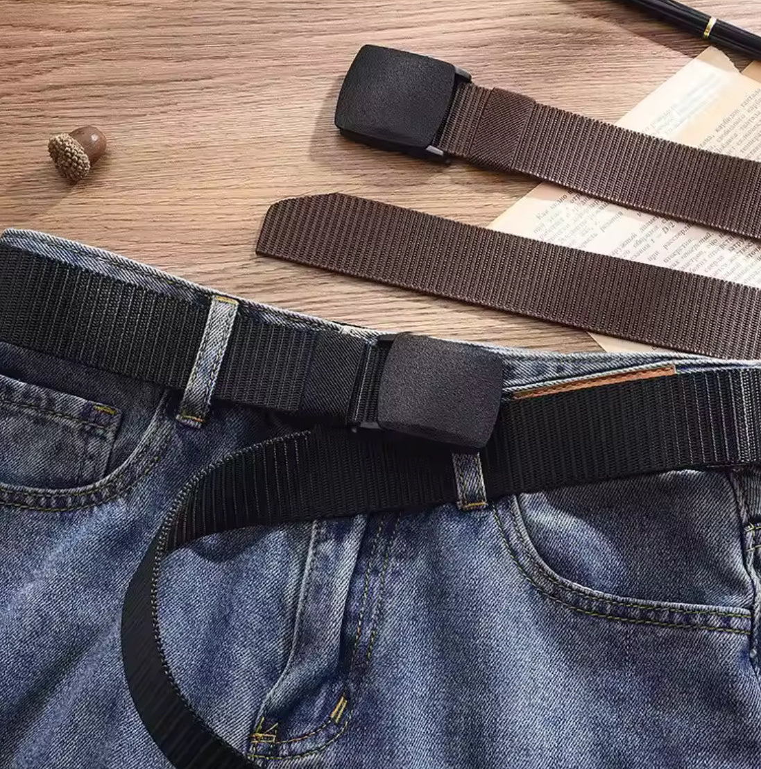 Men's casual canvas belt from Problems Solved featuring a metal-free design, shown in a close-up of the belt's textured fabric.
