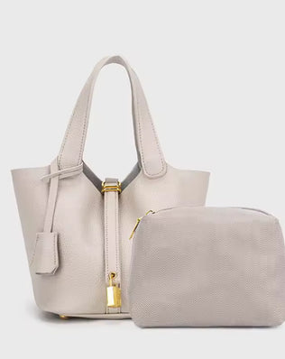 Classic Vegetable Women's Handbag by Problems Solved, simple bucket bag with a natural vegetable-tanned leather finish.