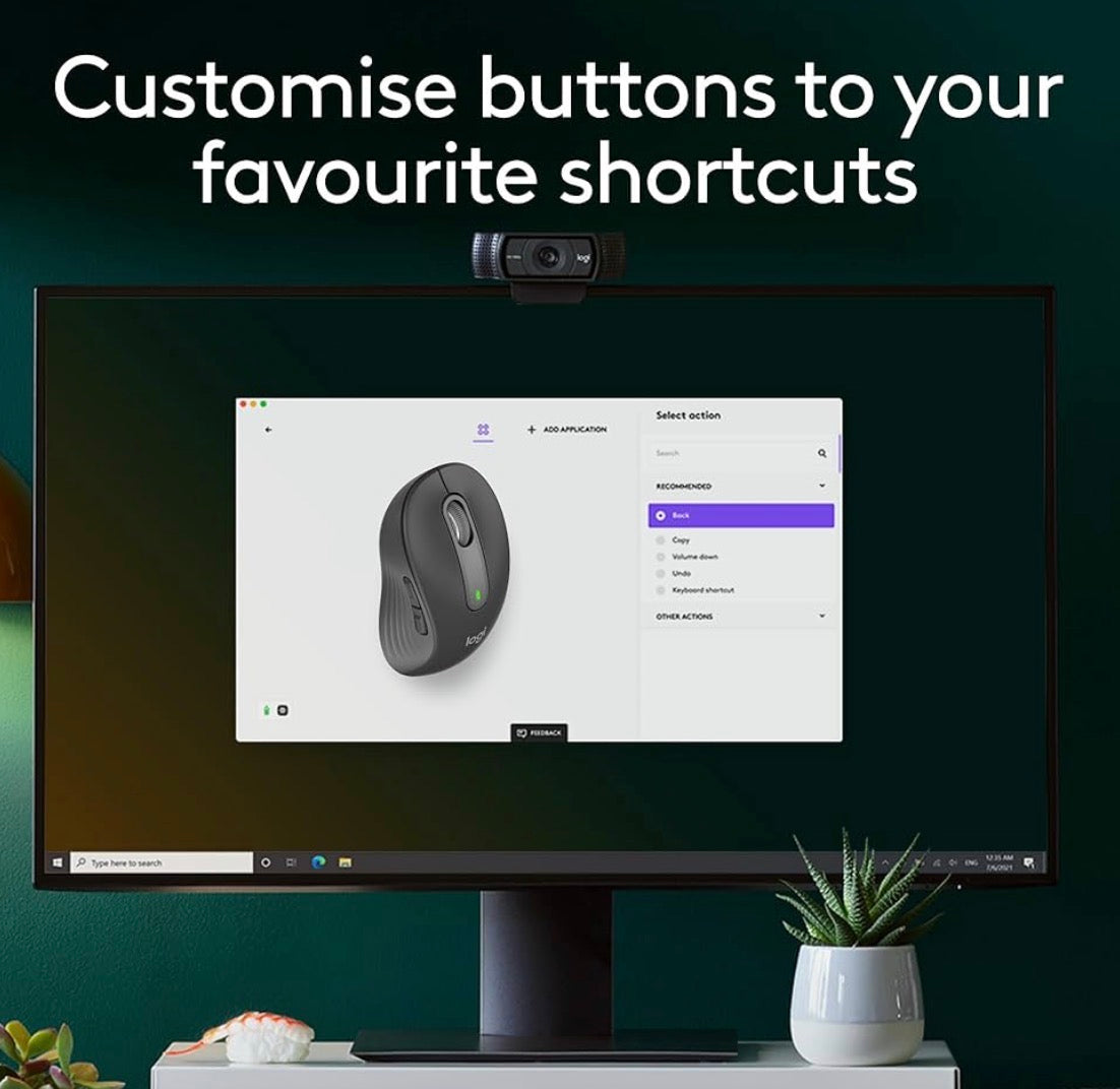 Problems Solved Signature M650 L full-size wireless mouse with ergonomic design and multiple buttons, shown on a desk surface.