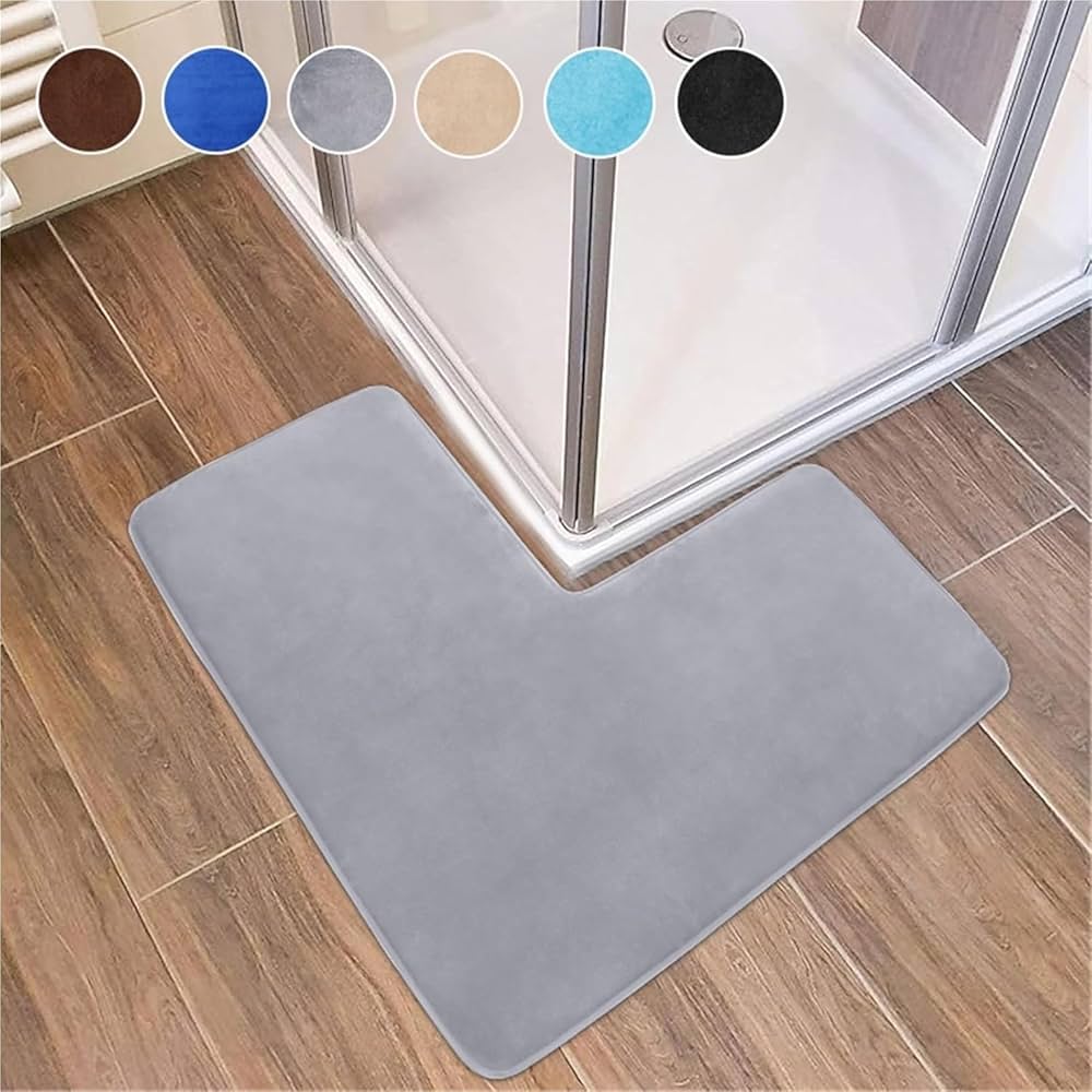 Soft coral fleece corner shower bath mat with non-slip backing, designed for bathroom floors by Problems Solved.