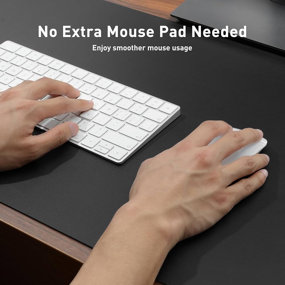 Problems Solved leather desk pad protector with non-slip PU surface, used as a mouse pad and office desk mat on a wooden desk.