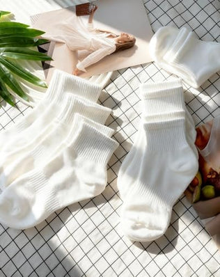 Pair of Problems Solved women's breathable wicking ankle socks with cushioning, shown in a close-up image.