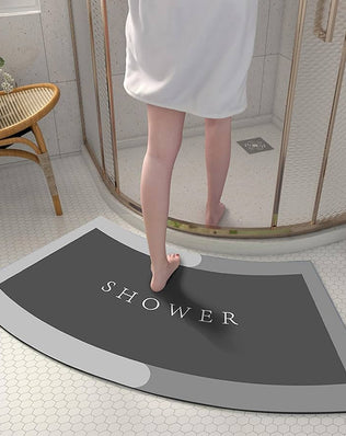 Problems Solved curved shower mat with absorbent, non-slip design and quadrant shape for safe, comfortable bath and shower use.