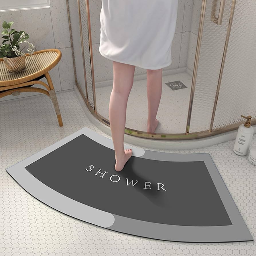 Problems Solved curved shower mat with absorbent, non-slip design and quadrant shape for safe, comfortable bath and shower use.