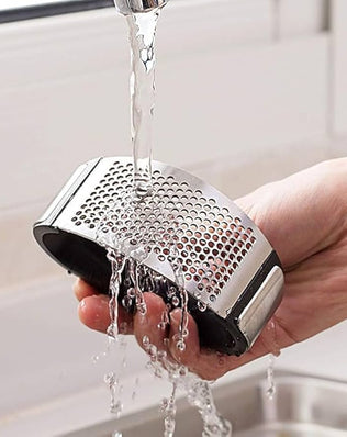 Problems Solved stainless steel garlic press with ergonomic handle and garlic crusher for easy mincing and crushing.