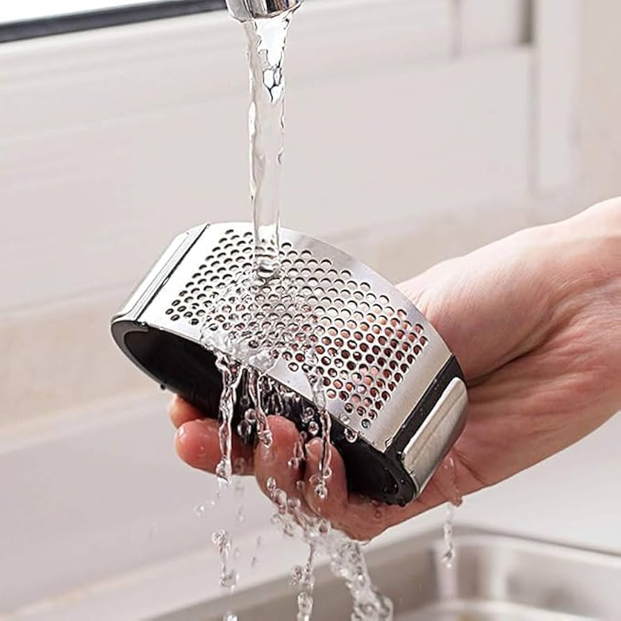 Problems Solved stainless steel garlic press with ergonomic handle and garlic crusher for easy mincing and crushing.