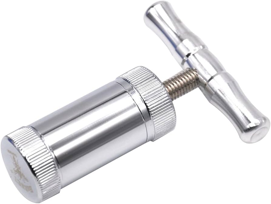 Problems Solved Tool Pollen T Press with T-handle for compressing pollen or herbs, featuring a durable metal construction.