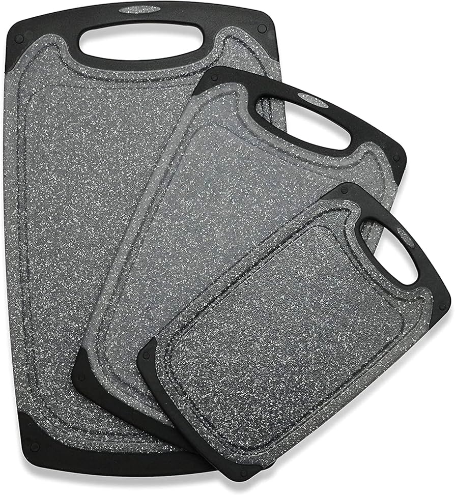Set of three Problems Solved chopping boards, including various sizes, made of durable wood for food prep and cutting tasks.