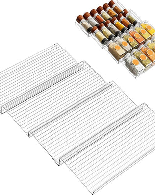 Problems Solved spice rack drawer organizer inside a kitchen cabinet showing neatly arranged spice jars.
