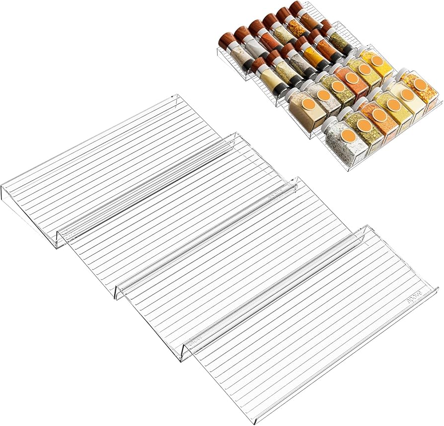Problems Solved spice rack drawer organizer inside a kitchen cabinet showing neatly arranged spice jars.