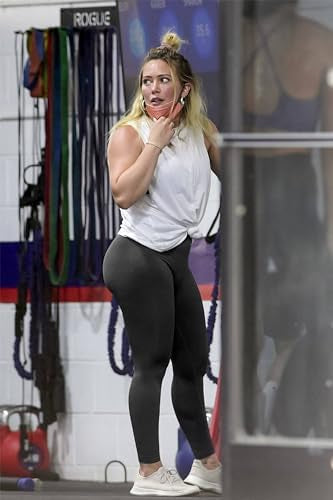 Problems Solved women's high waist scrunch butt leggings with lifting and push-up design, shown on a model in a gym setting.