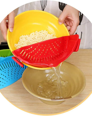 Problems Solved Snap Strainer clip-on heat-resistant silicone strainer shown attached to a pot for hands-free straining.