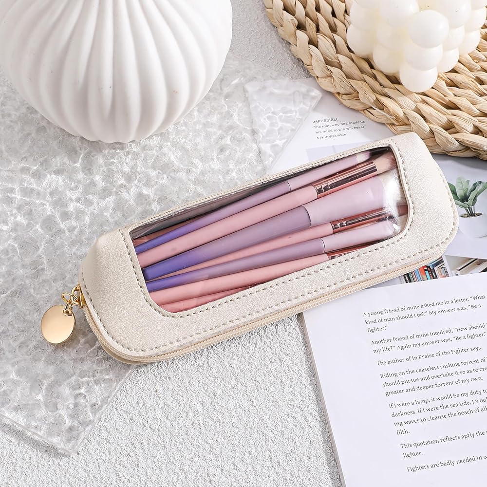 Small clear leather travel makeup bag with transparent design, ideal for storing brushes and cosmetics on the go.