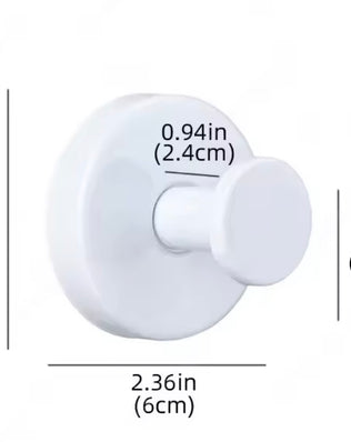 Metal suction cup towel hook from Problems Solved, mounted in a bathroom, holding a towel for easy access and organization.