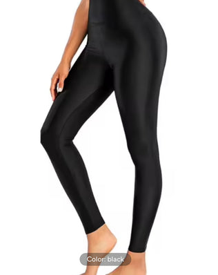 Shiny black high-elastic leggings for stage performance by Problems Solved, designed for a sleek, snug fit and eye-catching shine.