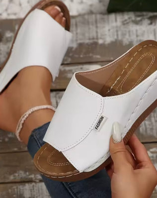 Women’s wedge slippers by Problems Solved featuring a summer fashion design with comfortable slip-on style and stylish wedge heel.
