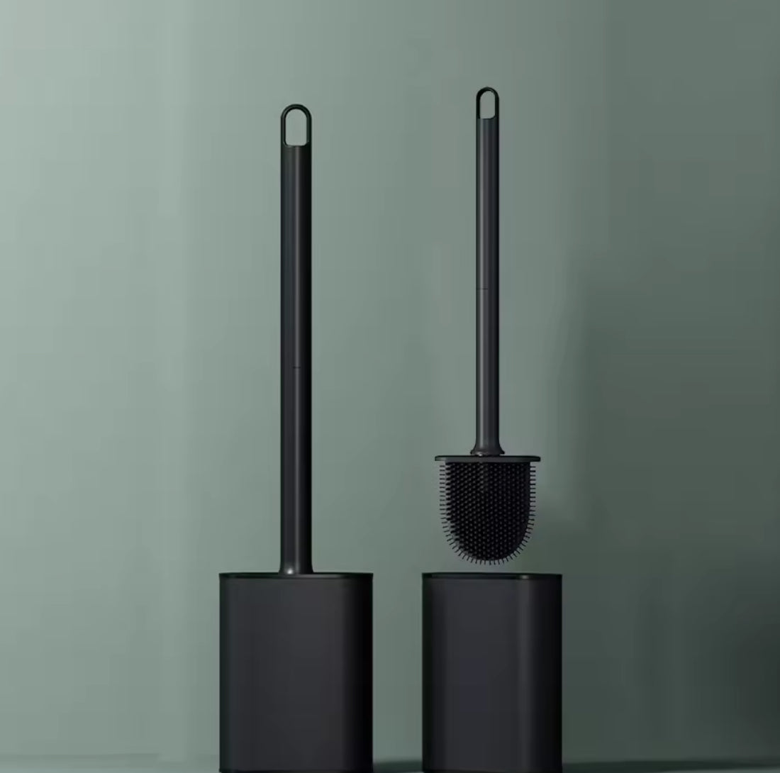Stainless steel base toilet brush holder with standing toilet cleaning brush from Problems Solved, designed for bathroom cleaning.