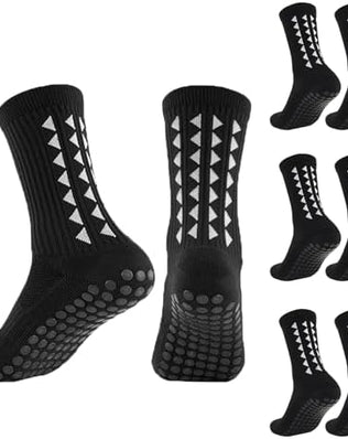 Three pairs of Problems Solved men's non-slip football grip socks showing reinforced ankle areas and textured soles for better traction.