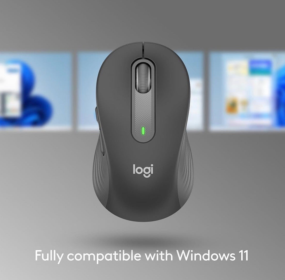 Problems Solved Signature M650 L full size wireless mouse with ergonomic design and multiple buttons on a desk.