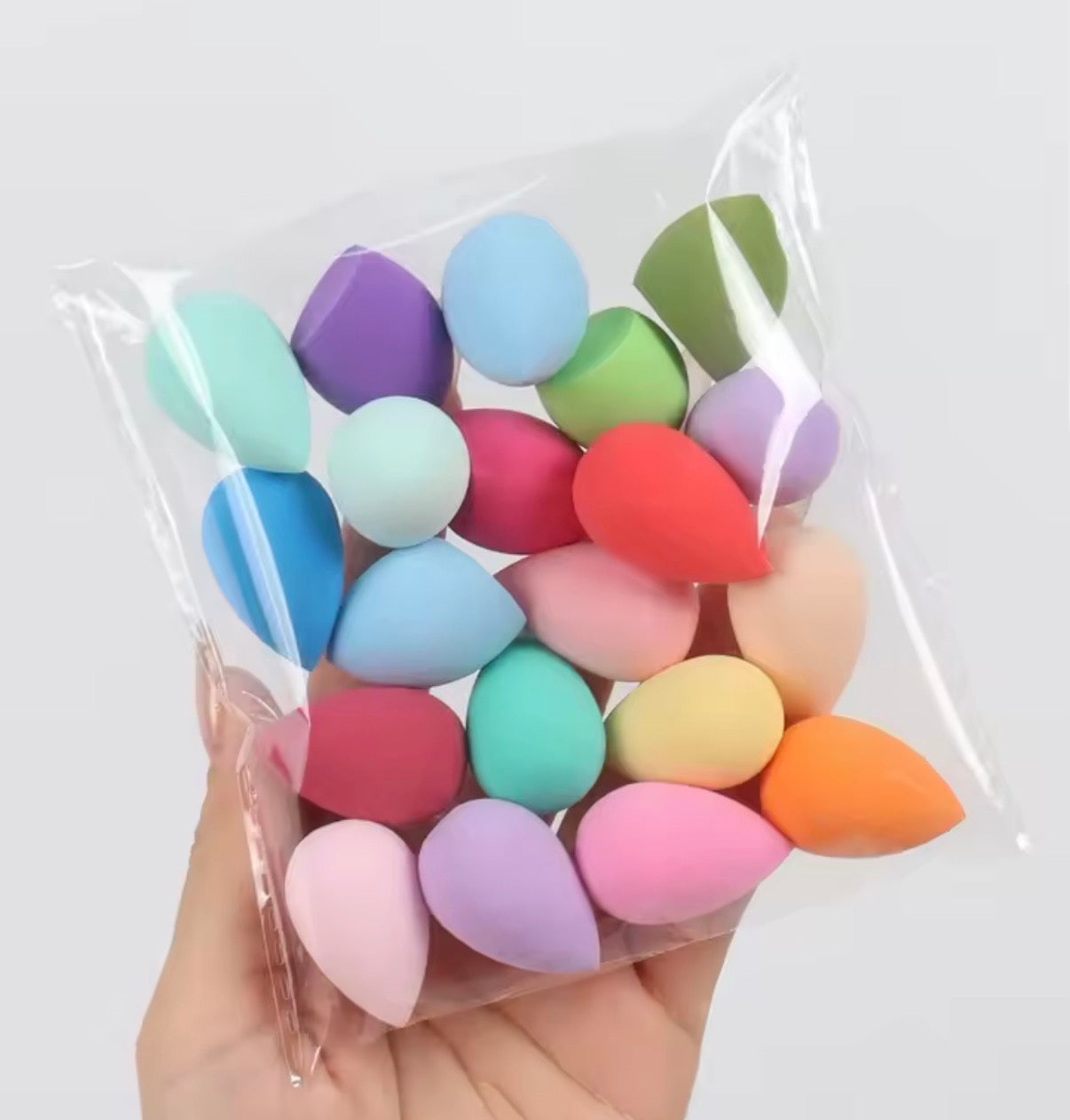 Set of 20 latex-free professional makeup sponges from Problems Solved, soft and versatile for flawless application.