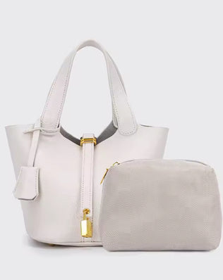 Classic vegetable-tanned leather women's handbag, simple bucket bag style from Problems Solved, featuring a clean and minimalist design.