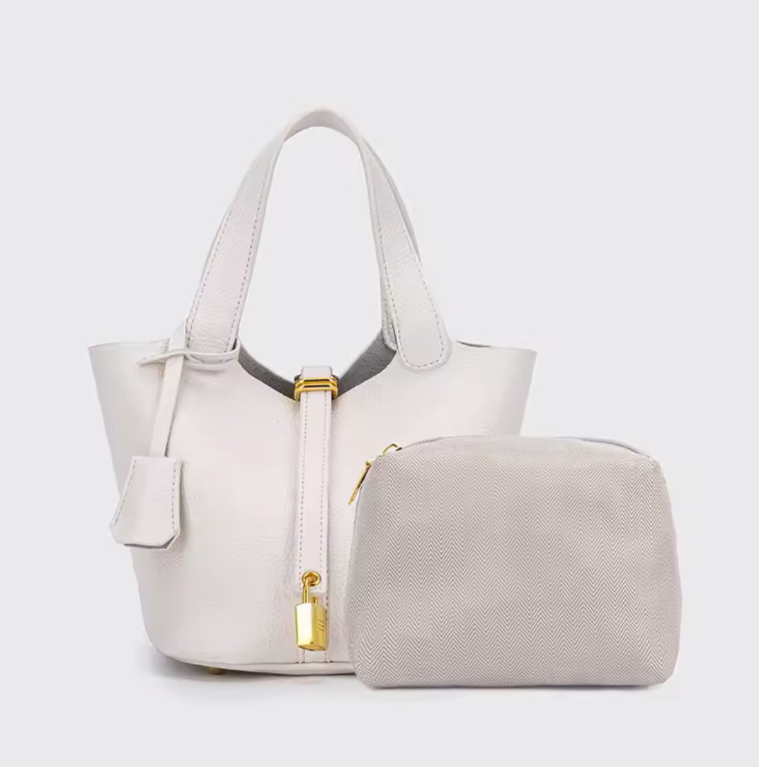 Classic vegetable-tanned leather women's handbag, simple bucket bag style from Problems Solved, featuring a clean and minimalist design.