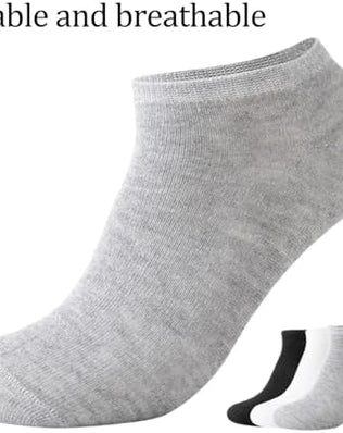 Pair of Problems Solved men's no-show trainer socks with breathable cotton, low-cut ankle design, shown in black on a white background.