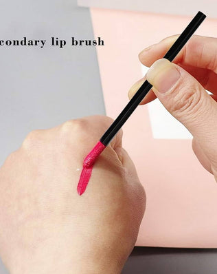 Set of 200 black disposable lip brushes for lipstick and lip gloss application, made by Problems Solved, shown in a neat arrangement.