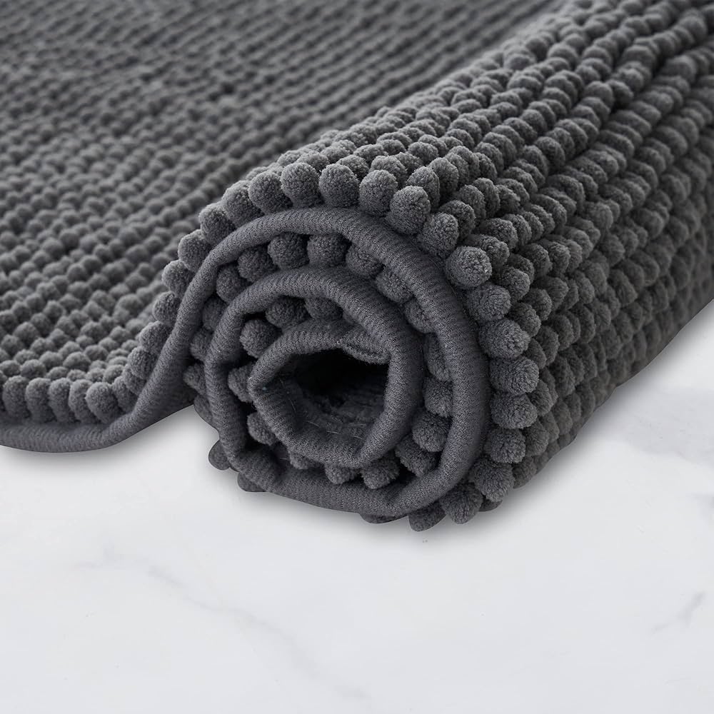 Non-slip, super absorbent bathroom mat from Problems Solved, machine washable bath mat with textured surface for safety.