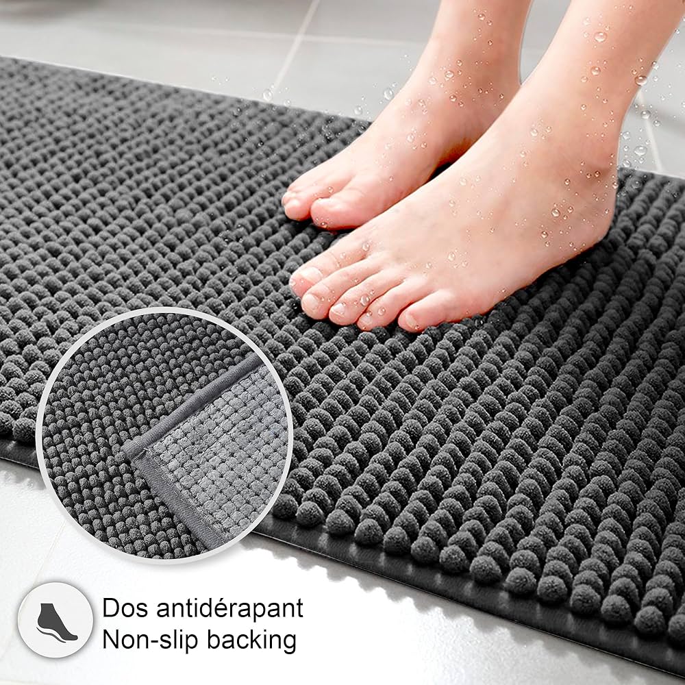 Problems Solved non-slip bath mat, super absorbent and machine washable bathroom mat shown on a bathroom floor.