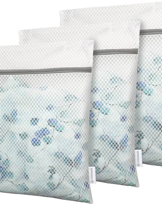 Three mesh laundry bags with zippers for delicates and socks, small washing bags by Problems Solved displayed in the image.