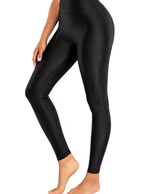 Shiny black high-elastic skinny leggings designed for stage performances by Problems Solved, showing a close-up of the glossy fabric.