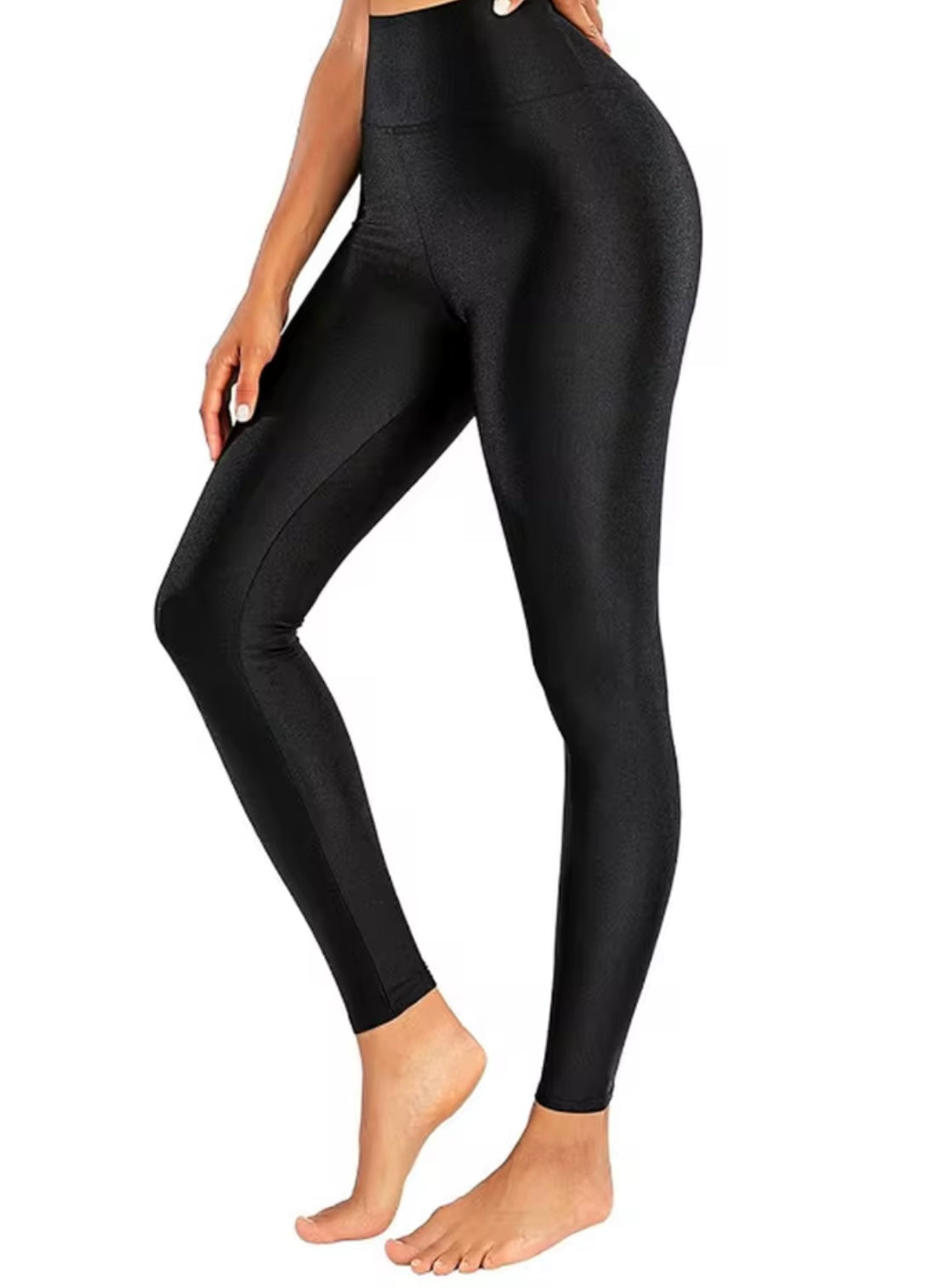 Shiny black high-elastic skinny leggings designed for stage performances by Problems Solved, showing a close-up of the glossy fabric.