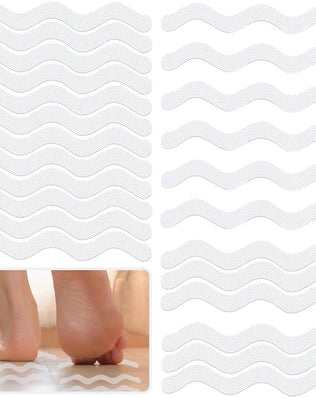 Problems Solved 24-piece self-adhesive non-slip shower stickers on a shower floor for safety and grip.