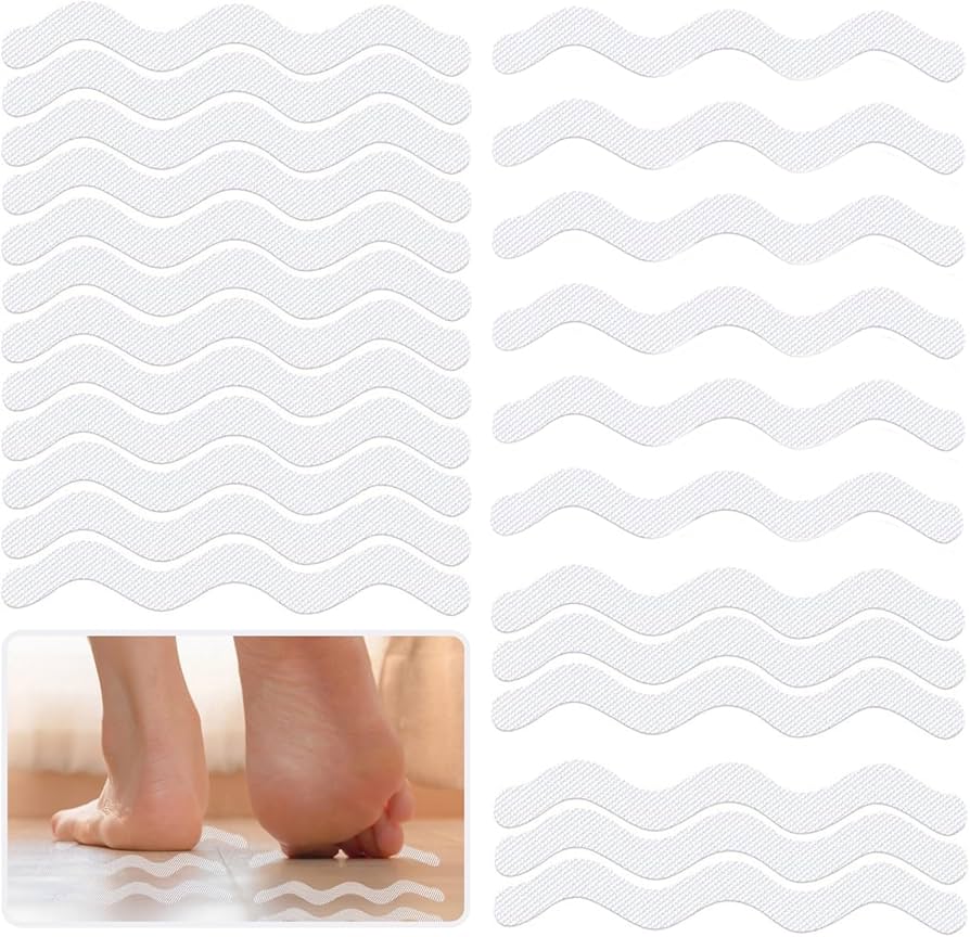 Problems Solved 24-piece self-adhesive non-slip shower stickers on a shower floor for safety and grip.