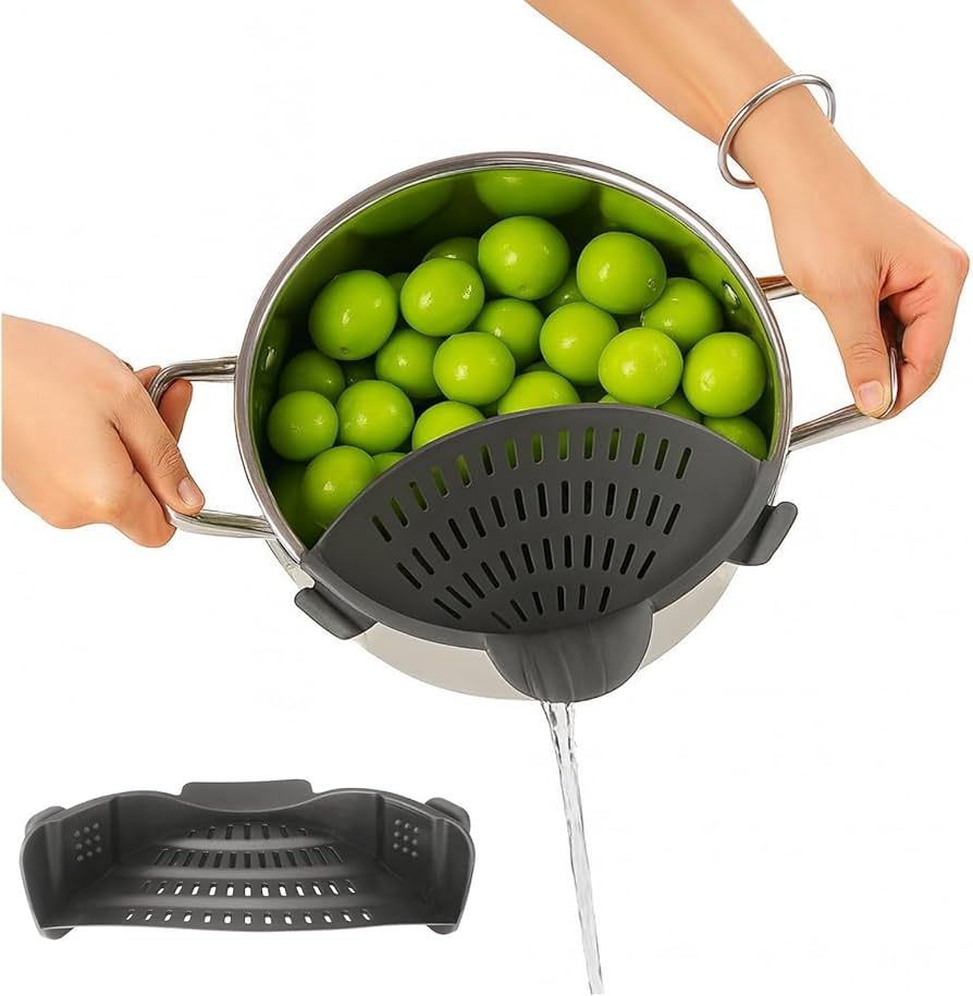 Silicone clip-on pot strainer from Problems Solved, heat-resistant kitchen drainer for pots and pans, shown in use on a stove
