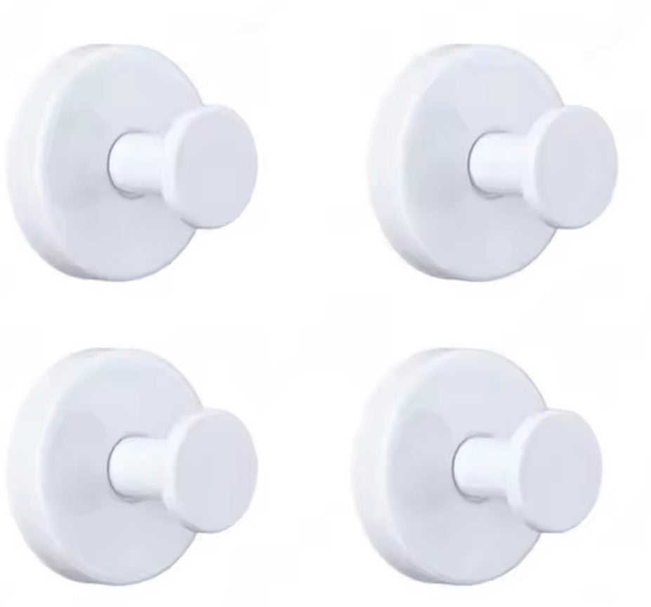Metal suction cup hook bathroom towel holder by Problems Solved attached to a tile wall for hanging towels or accessories.