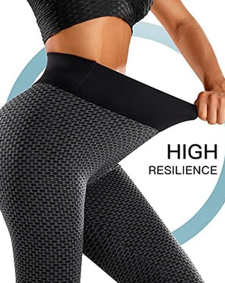 Women’s high-waisted gym leggings by Problems Solved with tummy control and butt lift design, shown on a model.