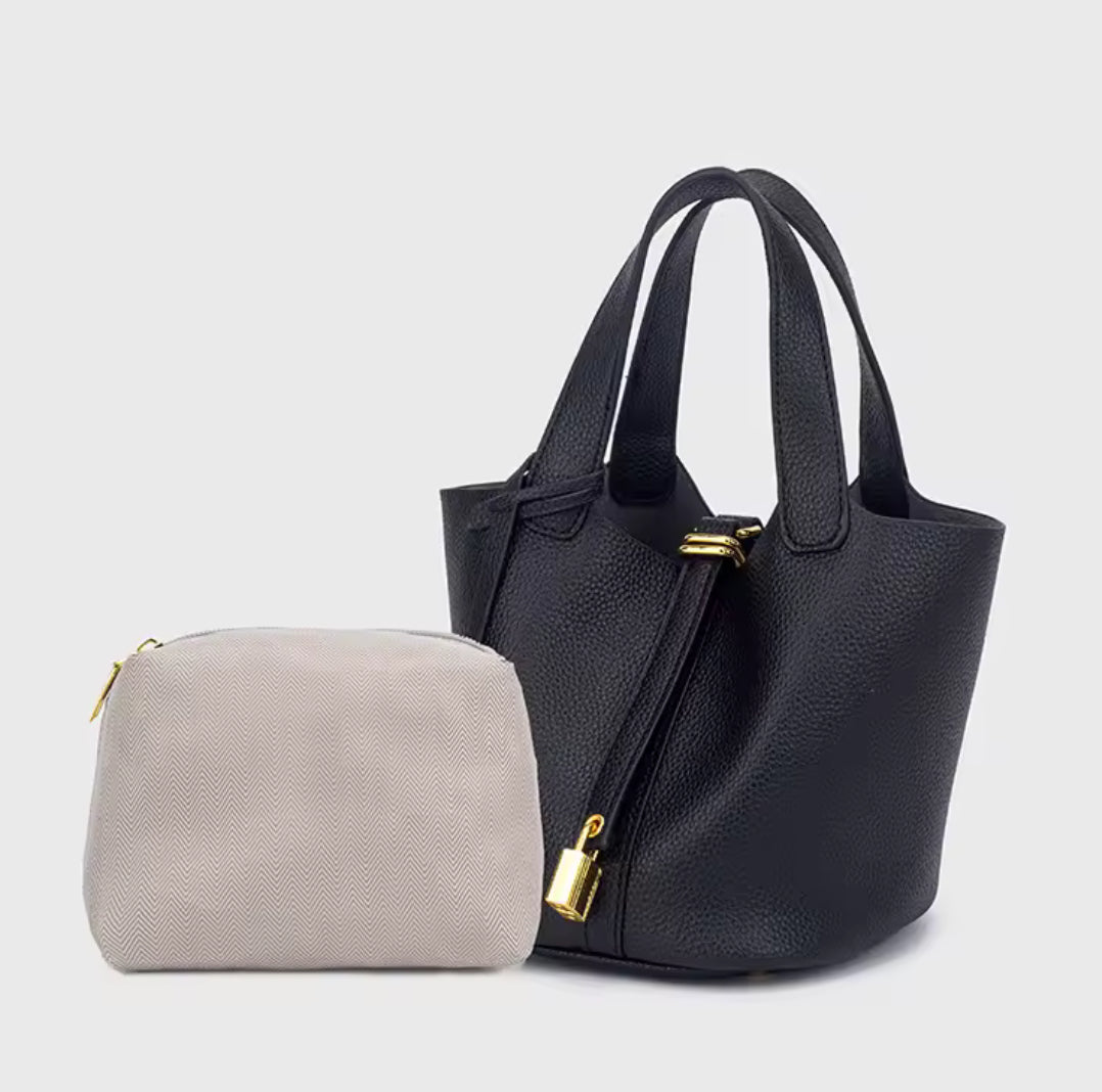 Classic Vegetable Women's Handbag by Problems Solved, simple bucket bag with smooth leather finish and spacious interior.