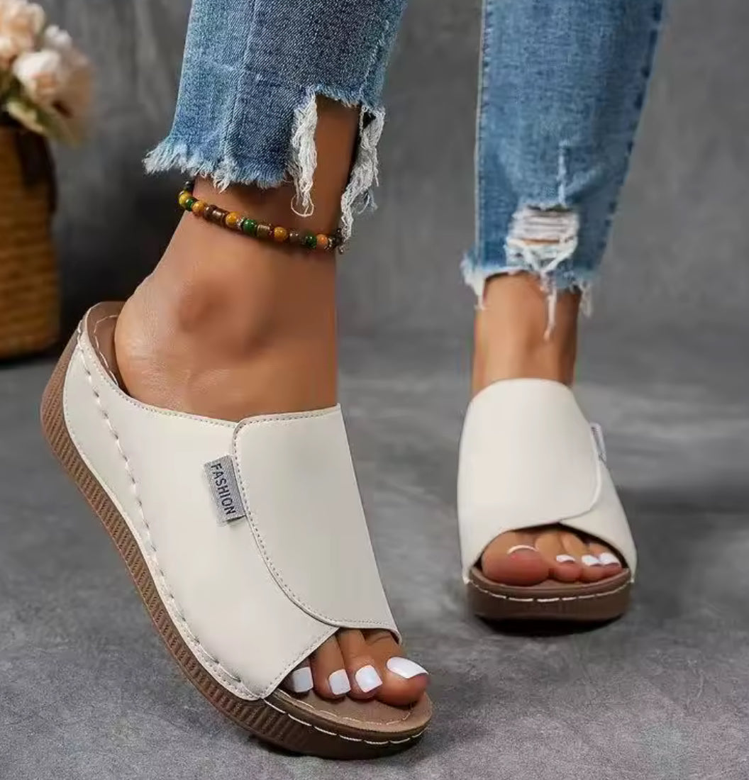Women’s wedge slippers by Problems Solved featuring summer fashion design with comfortable slip-on style and neutral color.