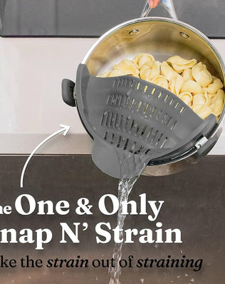 Problems Solved silicone pot strainer clip-on for pots and pans, heat-resistant kitchen pot drainer in use.