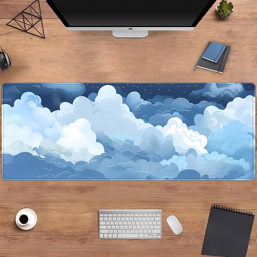 Blue and white cloud-themed desk mat by Problems Solved, featuring a soft, puffy surface ideal for gaming and workspace comfort.