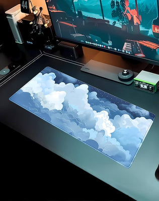 Blue and white Puffy Clouds desk mat by Problems Solved, featuring a cute gaming mouse pad with cloud design.
