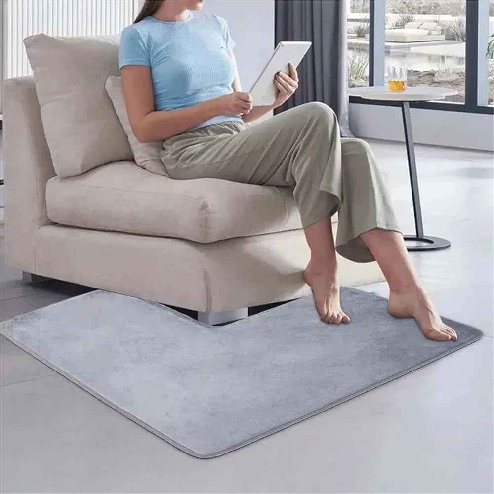Soft coral fleece shaped bath mat by Problems Solved, non-slip corner shower rug for bathroom floor comfort and safety.