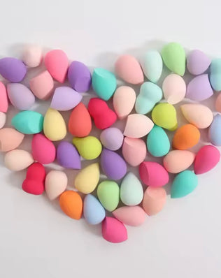 Set of 20 latex-free professional makeup sponges by Problems Solved, showing various sizes and shapes for flawless application.