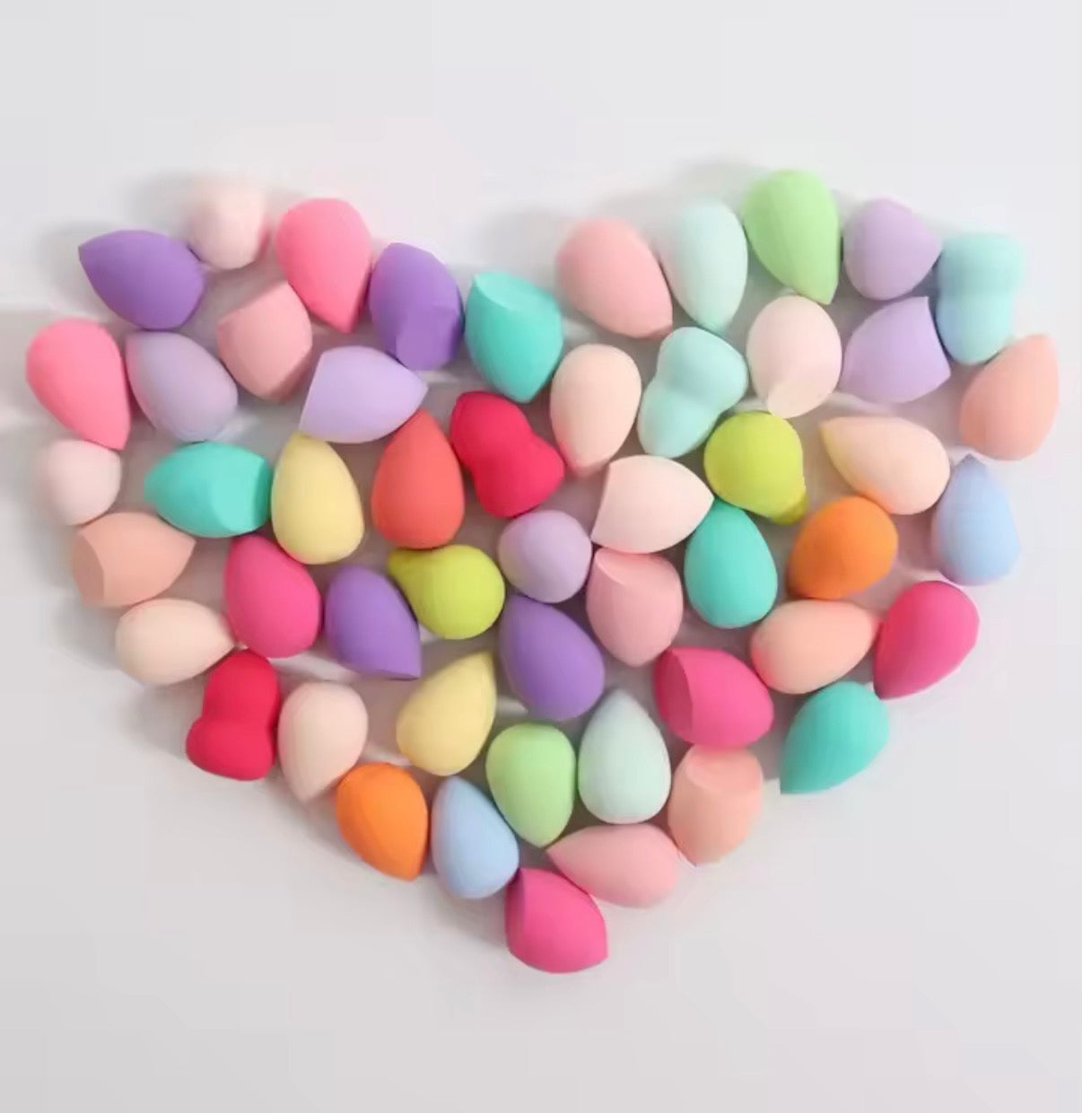 Set of 20 latex-free professional makeup sponges by Problems Solved, showing various sizes and shapes for flawless application.