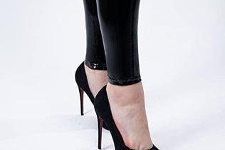 Women mirror faux patent leather leggings by Problems Solved, featuring reflective shiny stretch material and a sleek, form-fitting design.