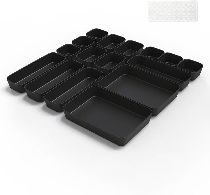 Problems Solved 16-piece drawer organiser set with clear plastic compartments for kitchen or bathroom storage.